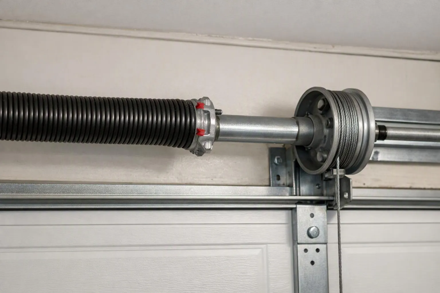 Torsion spring and cable drum above a garage door in San Bernardino and Orange County, CA
