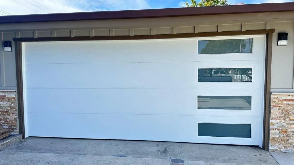 White contemporary garage door with stacked tinted windows in Ontario, CA